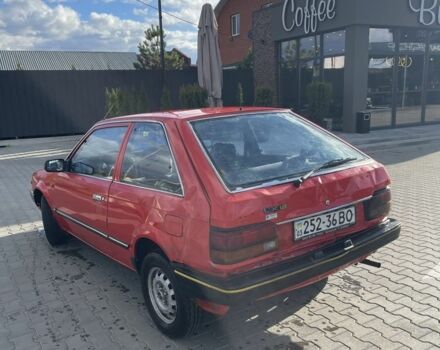 Красный Мазда 323, объемом двигателя 1.3 л и пробегом 225 тыс. км за 650 $, фото 2 на Automoto.ua