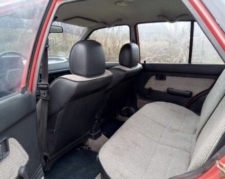 Червоний Мазда 323, об'ємом двигуна 1.3 л та пробігом 250 тис. км за 950 $, фото 4 на Automoto.ua