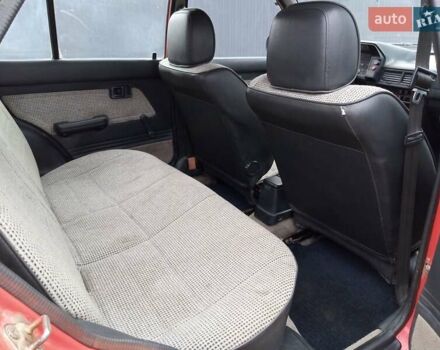 Червоний Мазда 323, об'ємом двигуна 1.3 л та пробігом 250 тис. км за 950 $, фото 11 на Automoto.ua
