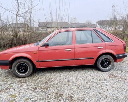 Червоний Мазда 323, об'ємом двигуна 1.3 л та пробігом 250 тис. км за 950 $, фото 1 на Automoto.ua