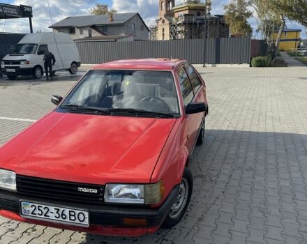 Красный Мазда 323, объемом двигателя 1.3 л и пробегом 225 тыс. км за 650 $, фото 1 на Automoto.ua