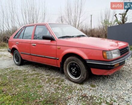 Червоний Мазда 323, об'ємом двигуна 1.3 л та пробігом 250 тис. км за 950 $, фото 6 на Automoto.ua