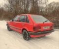 Красный Мазда 323, объемом двигателя 1.3 л и пробегом 250 тыс. км за 1200 $, фото 2 на Automoto.ua
