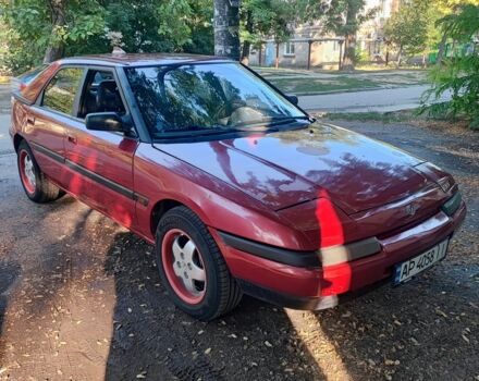 Красный Мазда 323, объемом двигателя 1.8 л и пробегом 444 тыс. км за 1200 $, фото 2 на Automoto.ua