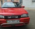 Красный Мазда 323, объемом двигателя 1.3 л и пробегом 400 тыс. км за 1500 $, фото 1 на Automoto.ua