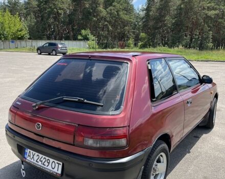 Червоний Мазда 323, об'ємом двигуна 1.3 л та пробігом 400 тис. км за 2000 $, фото 3 на Automoto.ua