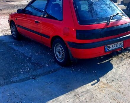 Красный Мазда 323, объемом двигателя 1.6 л и пробегом 348 тыс. км за 1600 $, фото 1 на Automoto.ua