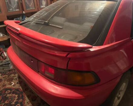 Красный Мазда 323, объемом двигателя 1.8 л и пробегом 150 тыс. км за 750 $, фото 1 на Automoto.ua