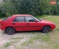Красный Мазда 323, объемом двигателя 1.8 л и пробегом 359 тыс. км за 1800 $, фото 1 на Automoto.ua