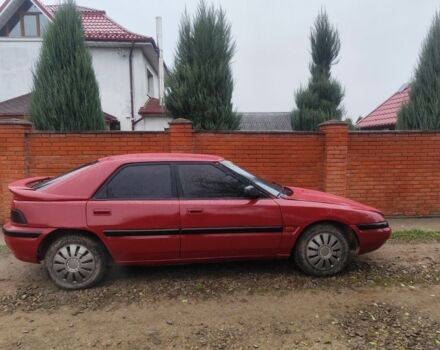 Красный Мазда 323, объемом двигателя 6 л и пробегом 130 тыс. км за 1500 $, фото 1 на Automoto.ua