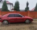 Красный Мазда 323, объемом двигателя 6 л и пробегом 130 тыс. км за 1500 $, фото 1 на Automoto.ua