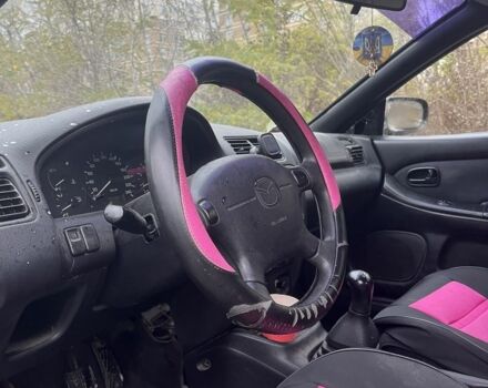 Красный Мазда 323, объемом двигателя 1.5 л и пробегом 323 тыс. км за 1100 $, фото 9 на Automoto.ua