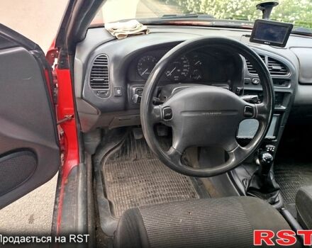Красный Мазда 323, объемом двигателя 1.5 л и пробегом 240 тыс. км за 2300 $, фото 4 на Automoto.ua