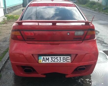 Красный Мазда 323, объемом двигателя 2 л и пробегом 300 тыс. км за 800 $, фото 2 на Automoto.ua