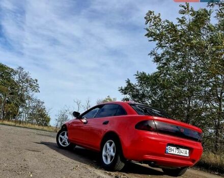 Красный Мазда 323, объемом двигателя 1.84 л и пробегом 303 тыс. км за 2650 $, фото 2 на Automoto.ua