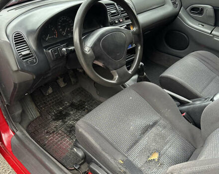 Красный Мазда 323, объемом двигателя 1.49 л и пробегом 450 тыс. км за 2000 $, фото 10 на Automoto.ua