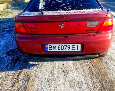 Червоний Мазда 323, об'ємом двигуна 1.5 л та пробігом 396 тис. км за 2000 $, фото 3 на Automoto.ua