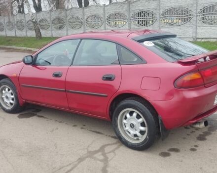 Красный Мазда 323, объемом двигателя 1.5 л и пробегом 367 тыс. км за 2400 $, фото 1 на Automoto.ua