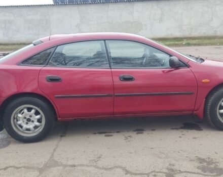 Красный Мазда 323, объемом двигателя 1.5 л и пробегом 367 тыс. км за 2400 $, фото 5 на Automoto.ua