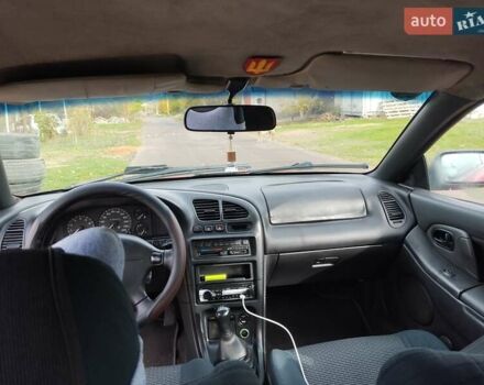 Красный Мазда 323, объемом двигателя 1.5 л и пробегом 258 тыс. км за 1600 $, фото 4 на Automoto.ua