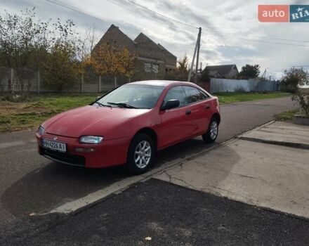 Красный Мазда 323, объемом двигателя 1.5 л и пробегом 258 тыс. км за 1600 $, фото 2 на Automoto.ua