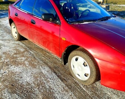 Червоний Мазда 323, об'ємом двигуна 1.5 л та пробігом 396 тис. км за 2000 $, фото 2 на Automoto.ua
