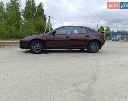Красный Мазда 323, объемом двигателя 1.5 л и пробегом 278 тыс. км за 2700 $, фото 1 на Automoto.ua