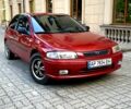 Красный Мазда 323, объемом двигателя 1.3 л и пробегом 340 тыс. км за 1850 $, фото 1 на Automoto.ua