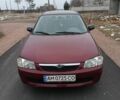 Красный Мазда 323, объемом двигателя 1.5 л и пробегом 285 тыс. км за 2000 $, фото 4 на Automoto.ua