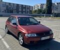 Красный Мазда 323, объемом двигателя 1.3 л и пробегом 300 тыс. км за 1000 $, фото 1 на Automoto.ua