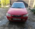 Красный Мазда 323, объемом двигателя 1.5 л и пробегом 277 тыс. км за 2000 $, фото 1 на Automoto.ua