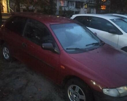 Красный Мазда 323, объемом двигателя 1.3 л и пробегом 250 тыс. км за 2500 $, фото 3 на Automoto.ua