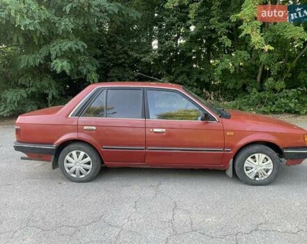 Червоний Мазда 323, об'ємом двигуна 1.3 л та пробігом 450 тис. км за 950 $, фото 6 на Automoto.ua