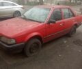 Красный Мазда 323, объемом двигателя 1.3 л и пробегом 300 тыс. км за 500 $, фото 1 на Automoto.ua