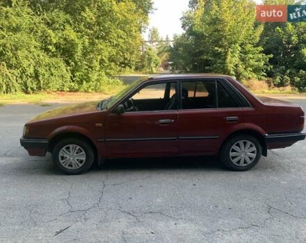 Червоний Мазда 323, об'ємом двигуна 1.3 л та пробігом 450 тис. км за 950 $, фото 1 на Automoto.ua
