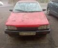 Красный Мазда 323, объемом двигателя 1.3 л и пробегом 300 тыс. км за 500 $, фото 1 на Automoto.ua