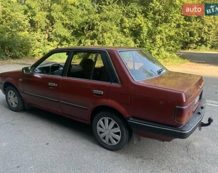 Червоний Мазда 323, об'ємом двигуна 1.3 л та пробігом 450 тис. км за 950 $, фото 2 на Automoto.ua