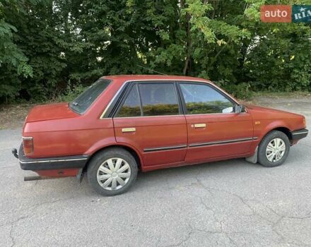 Червоний Мазда 323, об'ємом двигуна 1.3 л та пробігом 450 тис. км за 950 $, фото 5 на Automoto.ua