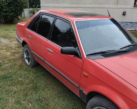 Красный Мазда 323, объемом двигателя 1.5 л и пробегом 260 тыс. км за 1450 $, фото 1 на Automoto.ua