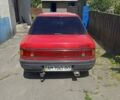 Красный Мазда 323, объемом двигателя 1.3 л и пробегом 327 тыс. км за 1100 $, фото 1 на Automoto.ua