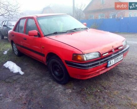 Красный Мазда 323, объемом двигателя 1.7 л и пробегом 270 тыс. км за 700 $, фото 1 на Automoto.ua