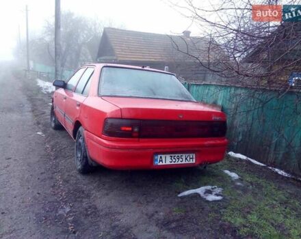 Красный Мазда 323, объемом двигателя 1.7 л и пробегом 270 тыс. км за 700 $, фото 3 на Automoto.ua