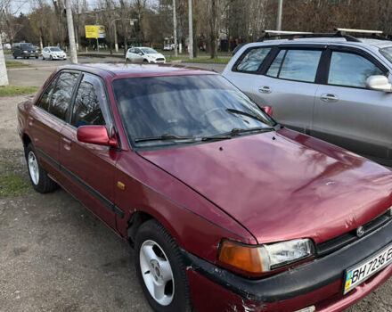 Красный Мазда 323, объемом двигателя 1.6 л и пробегом 350 тыс. км за 1200 $, фото 1 на Automoto.ua