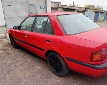 Красный Мазда 323, объемом двигателя 1.6 л и пробегом 260 тыс. км за 1000 $, фото 2 на Automoto.ua