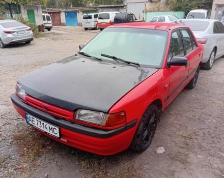 Красный Мазда 323, объемом двигателя 1.6 л и пробегом 260 тыс. км за 1000 $, фото 1 на Automoto.ua