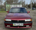 Красный Мазда 323, объемом двигателя 1.6 л и пробегом 350 тыс. км за 1200 $, фото 1 на Automoto.ua