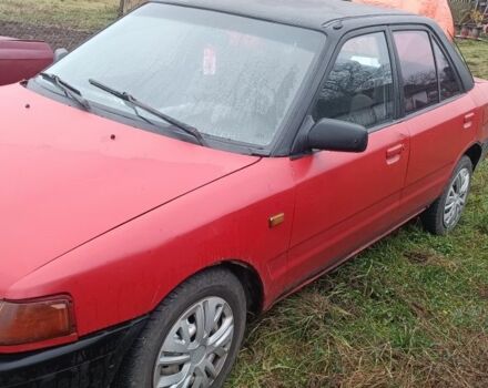 Красный Мазда 323, объемом двигателя 1.3 л и пробегом 300 тыс. км за 475 $, фото 1 на Automoto.ua