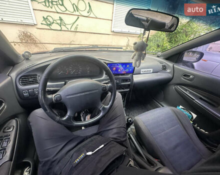 Красный Мазда 323, объемом двигателя 1.5 л и пробегом 295 тыс. км за 2500 $, фото 6 на Automoto.ua