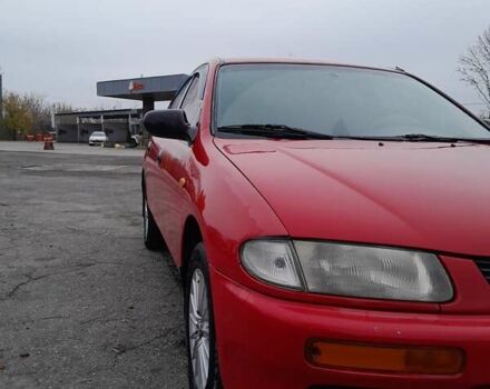 Червоний Мазда 323, об'ємом двигуна 1.49 л та пробігом 290 тис. км за 2800 $, фото 3 на Automoto.ua