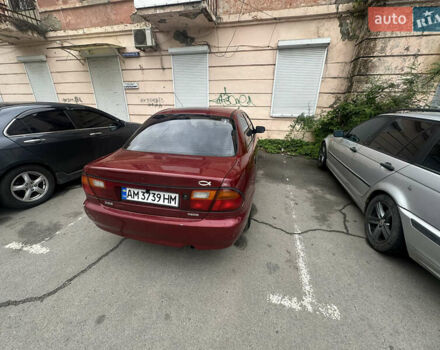 Красный Мазда 323, объемом двигателя 1.5 л и пробегом 295 тыс. км за 2500 $, фото 3 на Automoto.ua